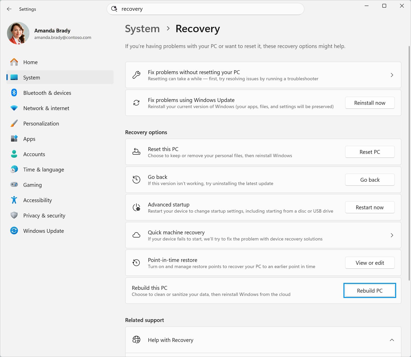 Schermata delle impostazioni di Windows 11 con l'opzione Rebuild PC evidenziata