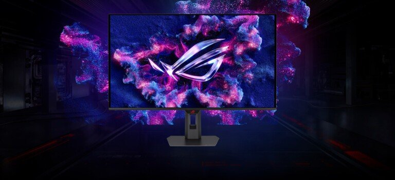 Monitor da gaming ASUS ROG Strix OLED in un ambiente scuro con luci viola e azzurre.